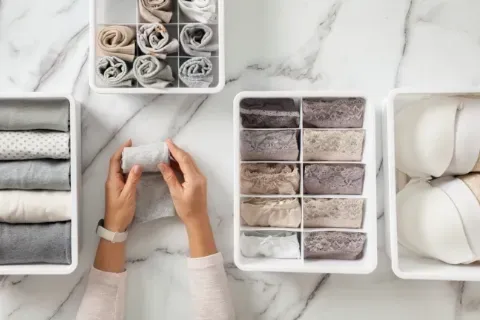 woman-hands-organizing-clothing